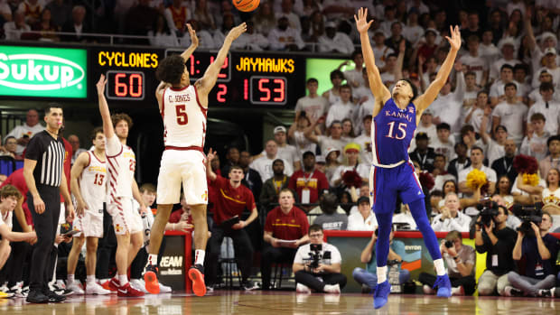 Feb 4, 2023; Ames, Iowa, USA; Iowa State Cyclones guard Curtis Jones (5) shoots the ball against Kansas Jayhawks guard Kevin McCullar Jr. (15) at James H. Hilton Coliseum. Mandatory Credit: Reese Strickland-USA TODAY Sports  
